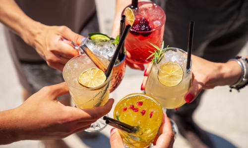 Residents holding their drinks together near Cambridge Place Apartments in Montgomery, Alabama