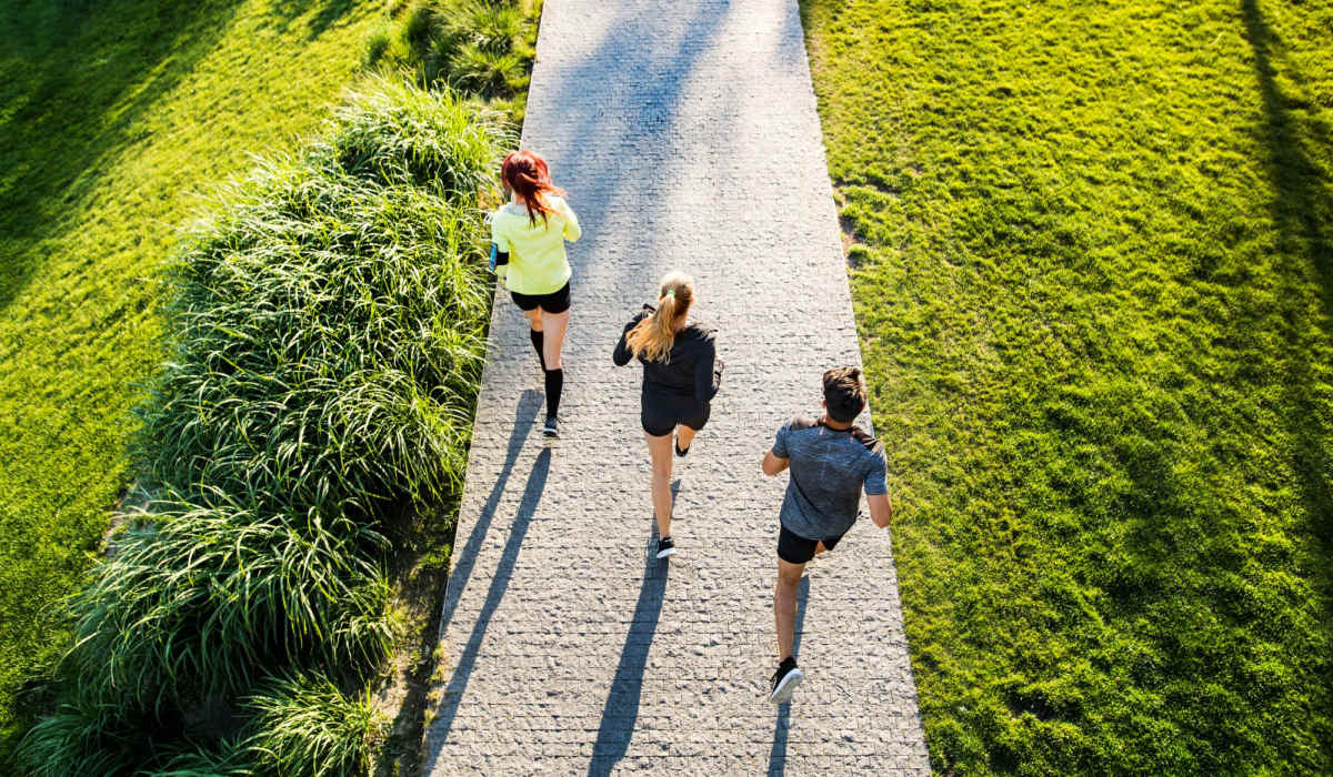 Residents running on a trail near Polo Run Apartments in Stockton, California