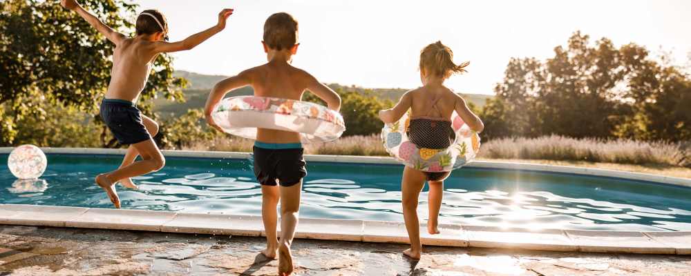 Kids jumping into a swimming pool at The Summits in Graniteville, South Carolina