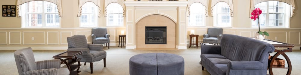 Resident lounge with fireplace at The Heritage at Eldridge Parkway in Houston, Texas