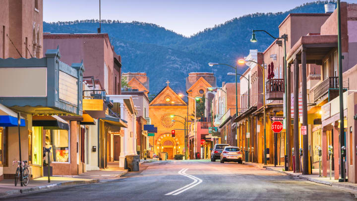 Street view of downtown Santa Fe at dusk.