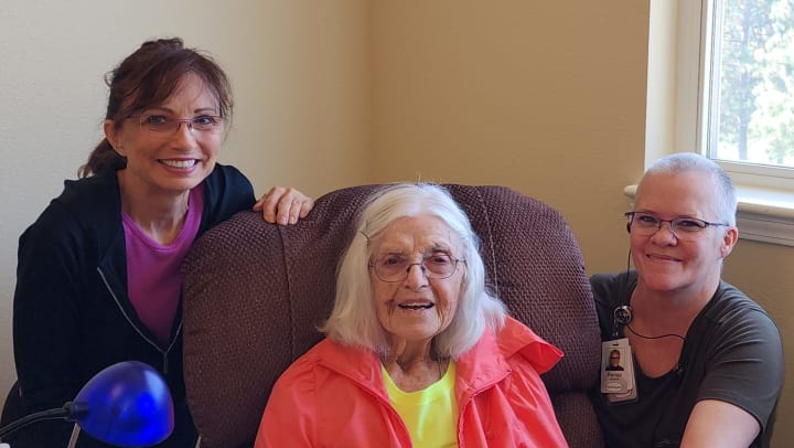 Renda Hansen with a Touchmark resident and the resident