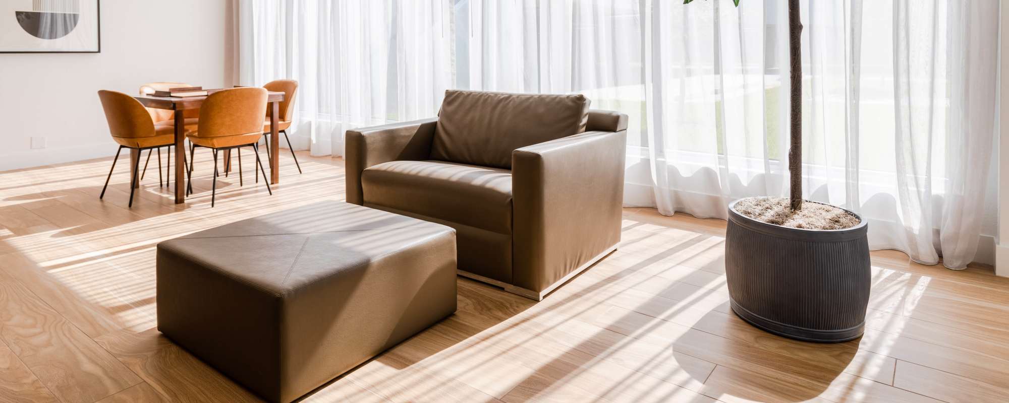 Spacious living room with a couch, table and chairs at  Alture Westland in Hialeah, Florida