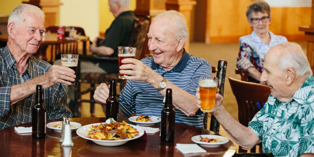 Three residents enjoying some food and drinks at Fancho's at The Springs at Missoula in Missoula, Montana