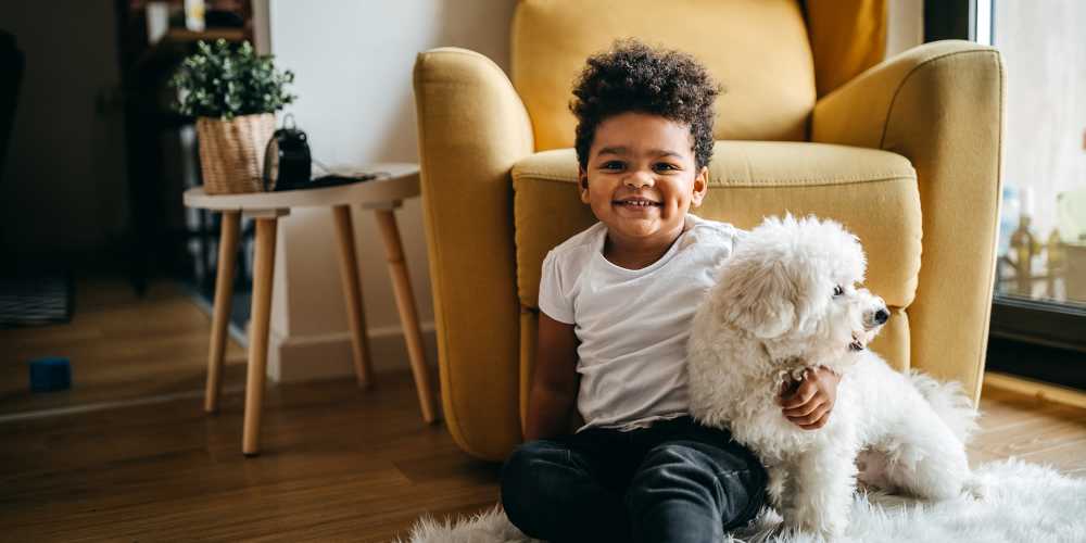 Resident's child and her puppy in their new apartment at The Griff in Charlotte, North Carolina