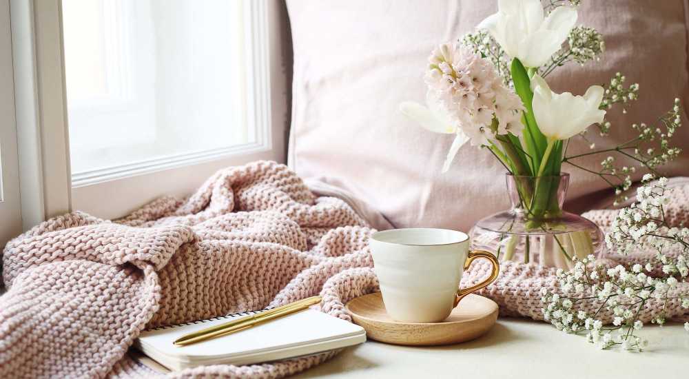Bright bedroom with a window at Aven Residences in Houston, Texas