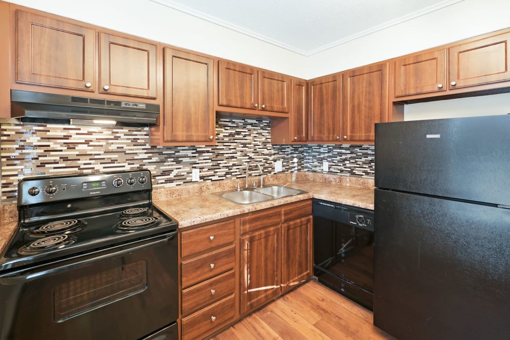 Beautifully updated kitchen features a backsplash and new countertops {location_name}} in Birmingham, Alabama