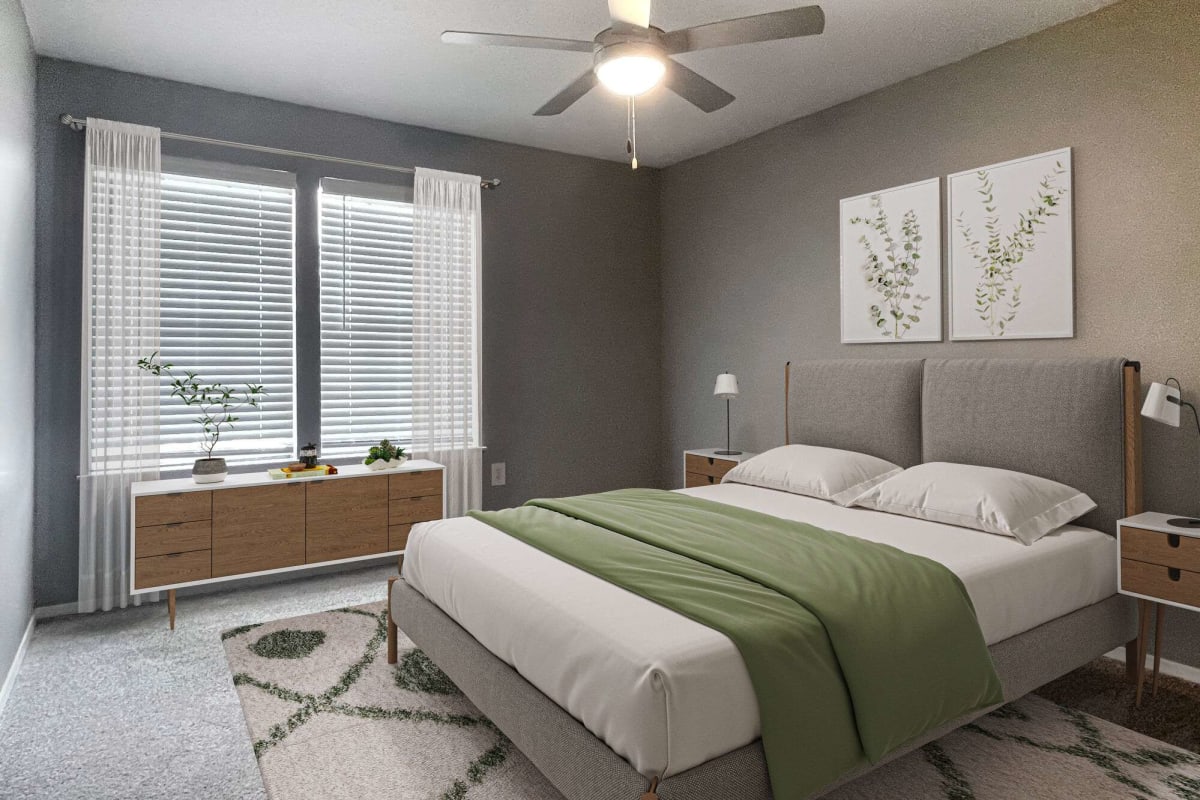 Renovated Resident bedroom with plush carpeting at Atlas at Lakeview in Baton Rouge, Louisiana