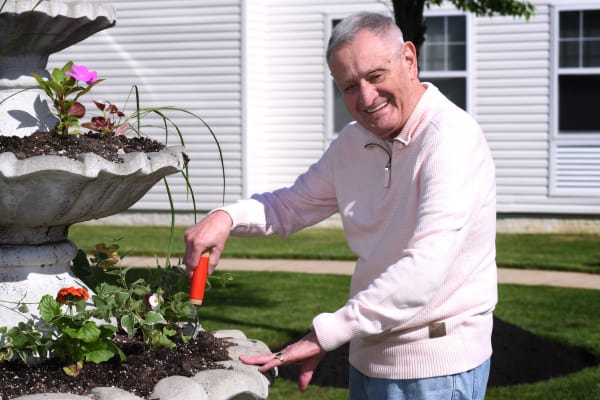 Senior resident enjoying a beautiful day outside at Mattison Crossing at Manalapan Avenue in Freehold, New Jersey