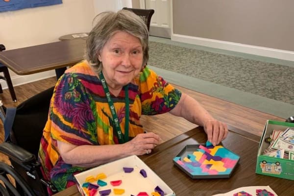 Resident at an event smiling at the camera at Traditions of Lansdale in Lansdale, Pennsylvania