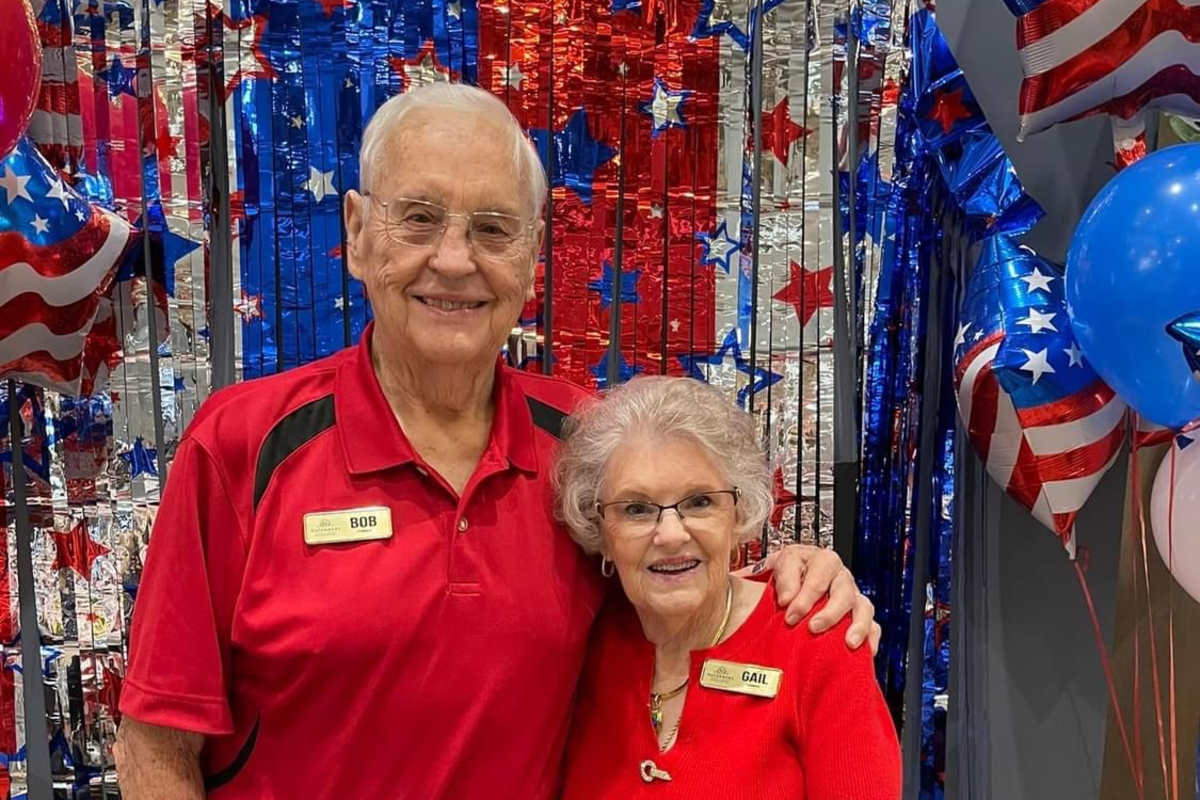 Senior couple smiling at Watermere at Flower Mound in Flower Mound, Texas