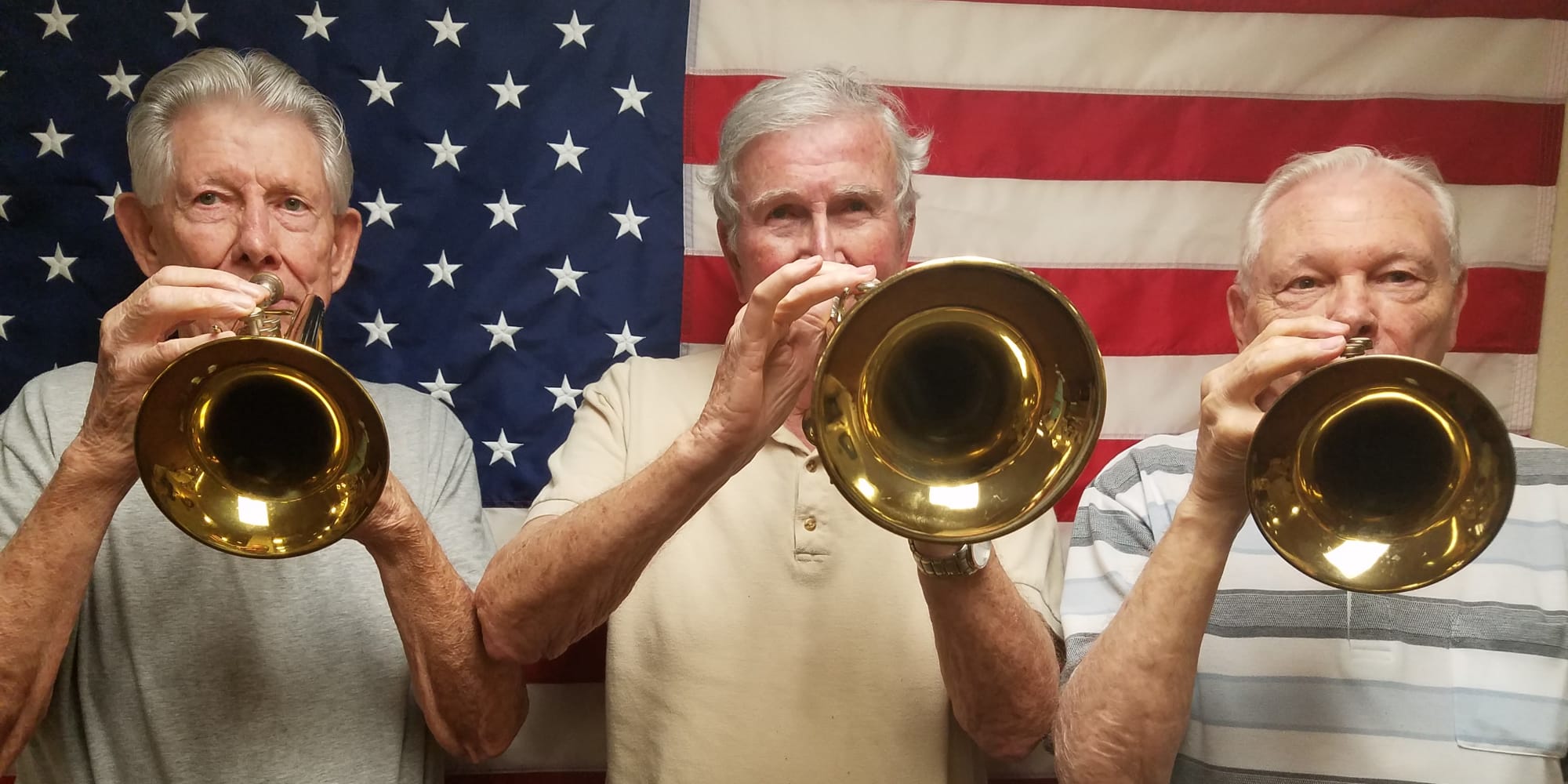 Three residents playing trumpets at Chesterfield Heights in Midlothian, Virginia