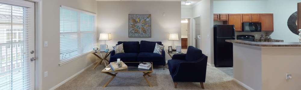 A spacious living room connecting to kitchen at Preserve at Windsor Lake in Columbia, South Carolina