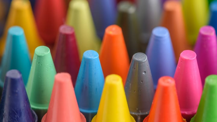 Close-up view of colorful and pastel crayons