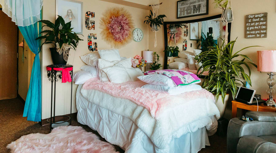 Comfortably decorated private resident bedroom at Cascade Park Vista Assisted Living in Tacoma, Washington