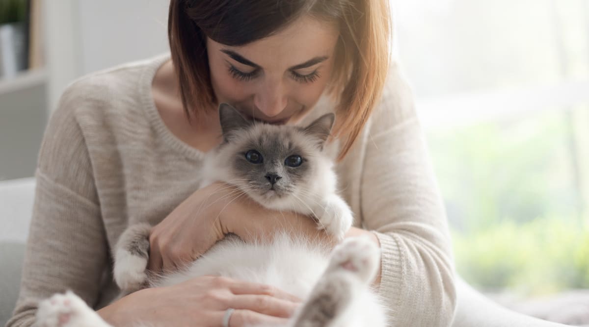 Resident hugging her cat at Issaqueena Village in Central, South Carolina