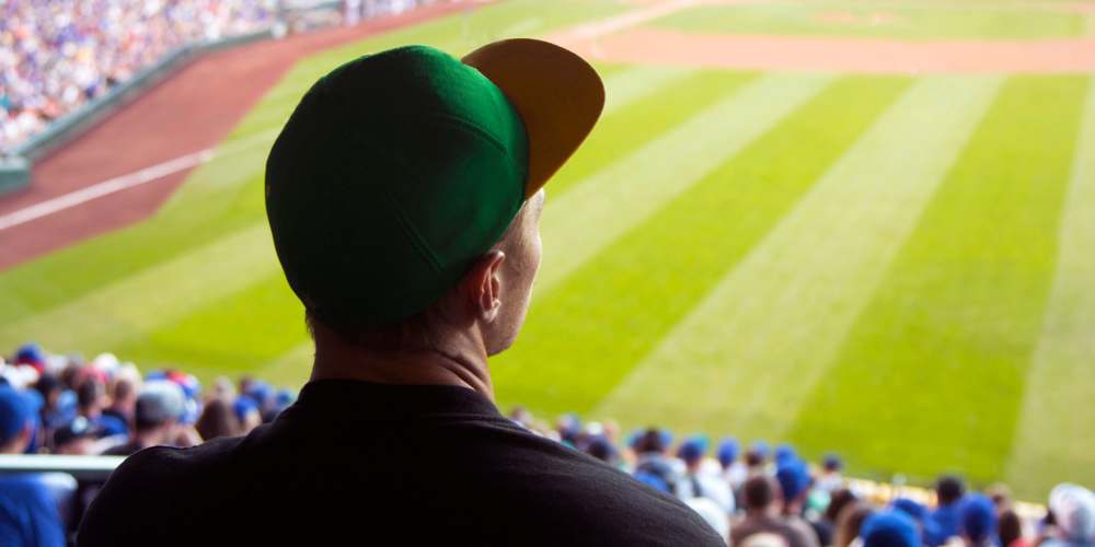 A man at a baseball game near Lincoln Square in Wilmington, Delaware