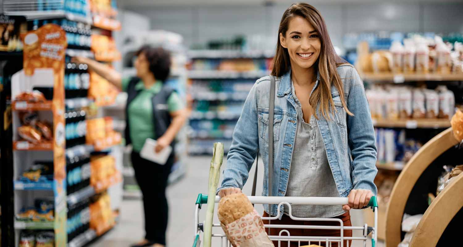 Resident woman with a cart at supermarket near Sherwood Pointe Apartments in Shawnee, Oklahoma
