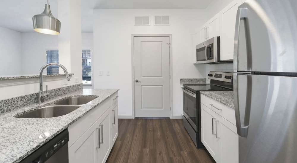 Kitchen with raised countertop at The Warrick in Nashville, Tennessee