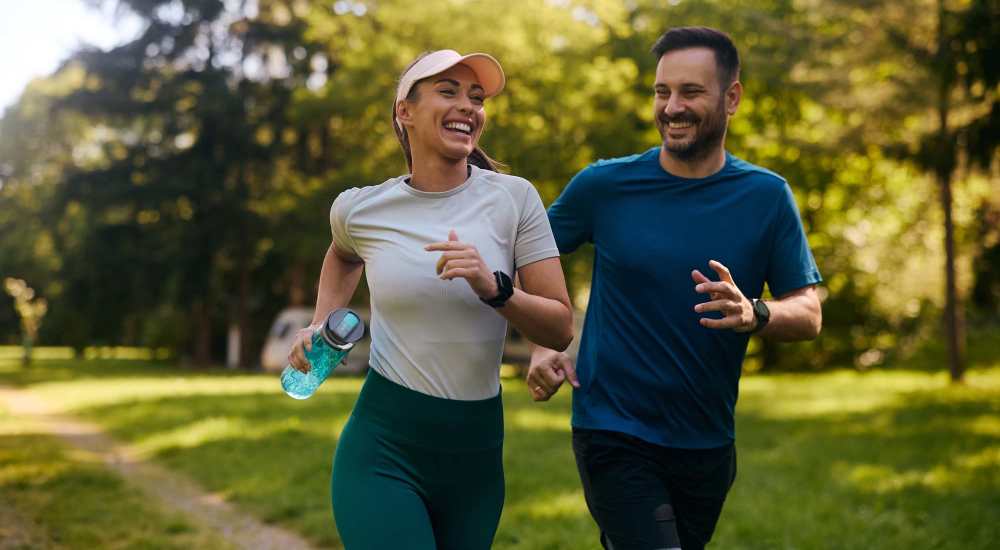 Couple jogging in park near The Vance Apartments in Dallas, Texas