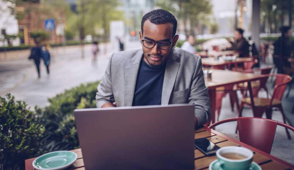 Resident working in his laptop at Fox Hollow in Orlando, Florida