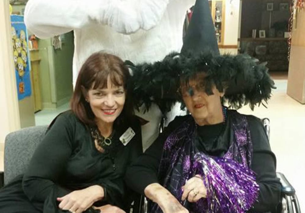 Caregiver and resident dressed up for Halloween at Maple Ridge Care Center in Spooner, Wisconsin