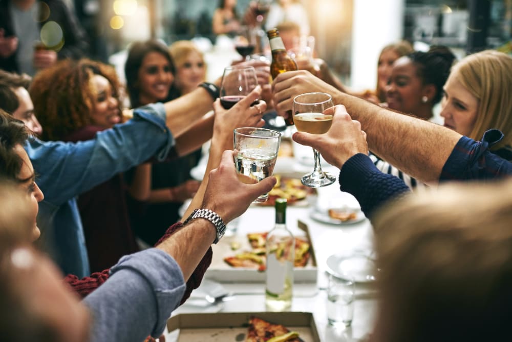 Friends enjoying wine and dinner near Deer Valley in Guilderland, New York