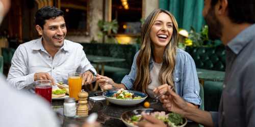 Residents enjoying feast at their favorite restaurant near The Dunes Apartments in Jacksonville, Florida