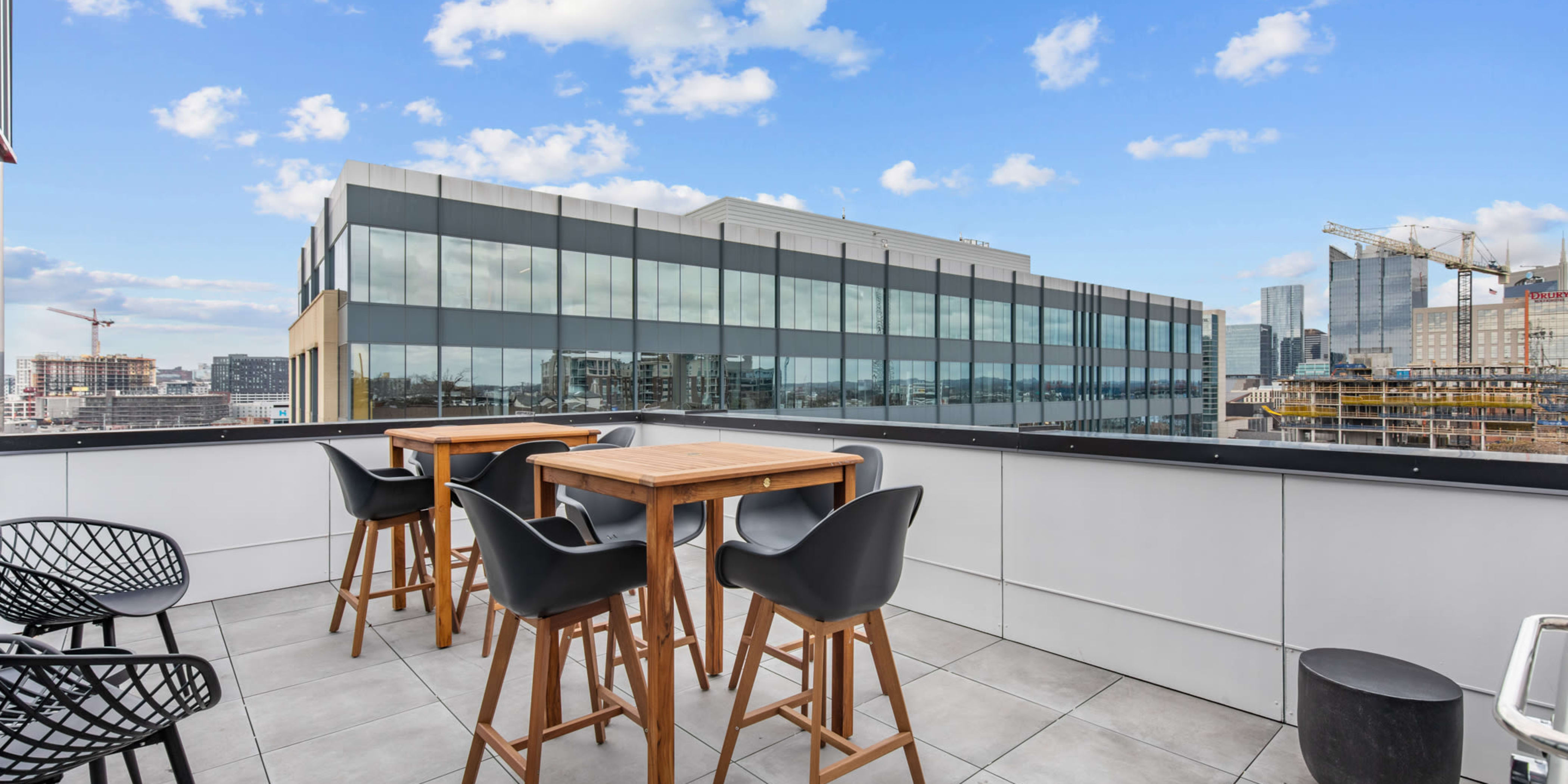 Terrace with seating and city views at Rutledge Flats | Apartments in Nashville, TN