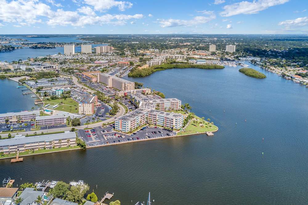 Aerial of apartment complex and waterfront views at Waters Pointe in South Pasadena, Florida