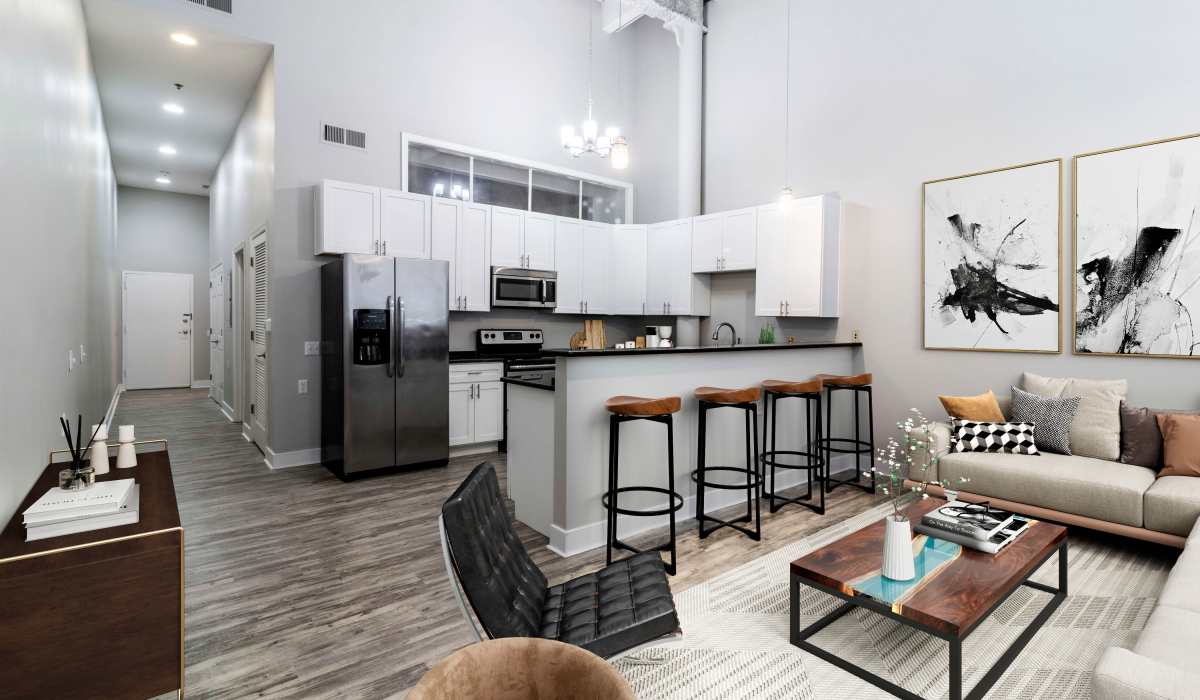 A furnished apartment living room and kitchen at Broadway Apartments in Richmond, Virginia