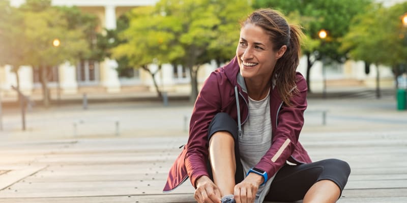 A resident taking a break from exercising on a path near O'Neill Heights East in Oceanside, California