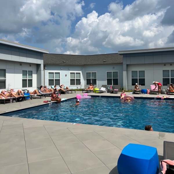 Residents in pool at The Quarters at Bloomington in Bloomington, Indiana