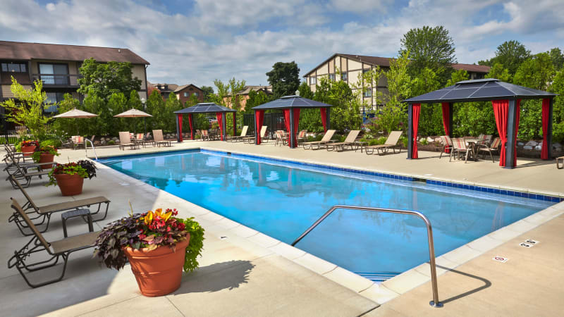 Pool and clubhouse at The Trilogy Apartments in Belleville