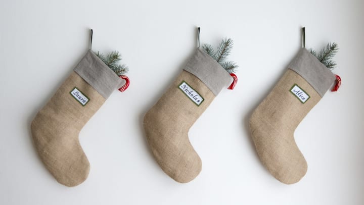 Christmas stockings hanging with pine tree and candy canes