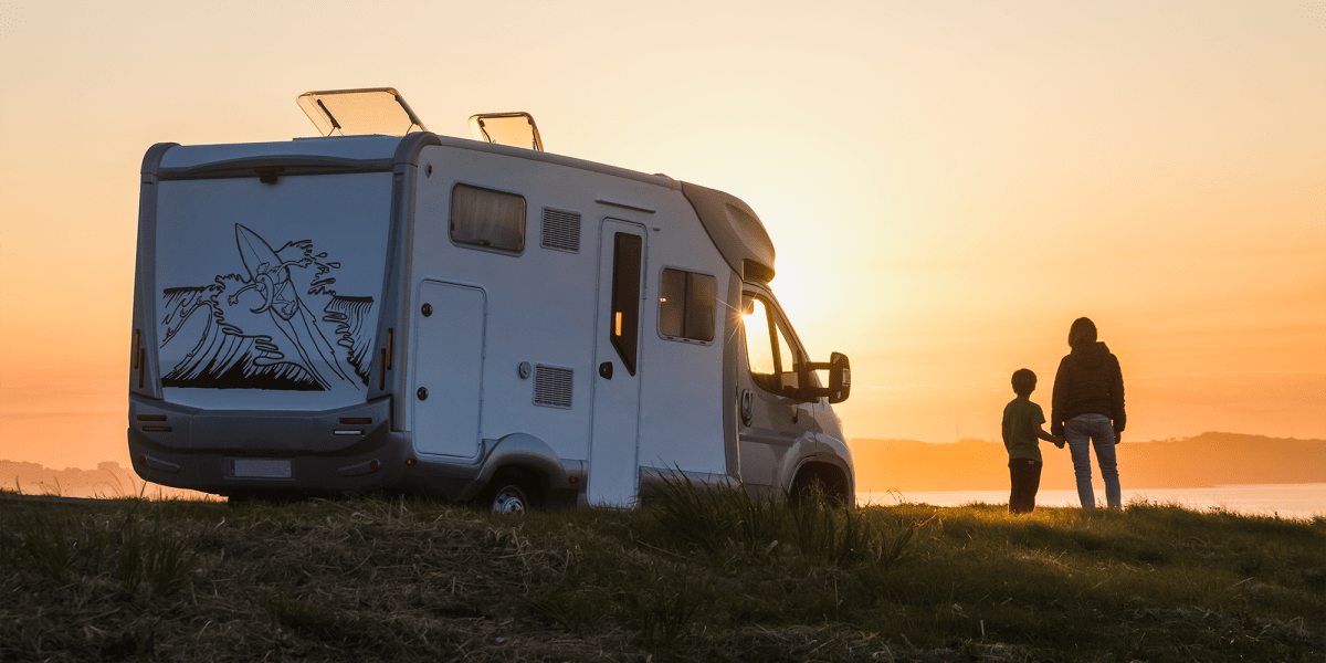 A parent and child standing next to an RV near Another Closet Storage in Spring Branch, Texas