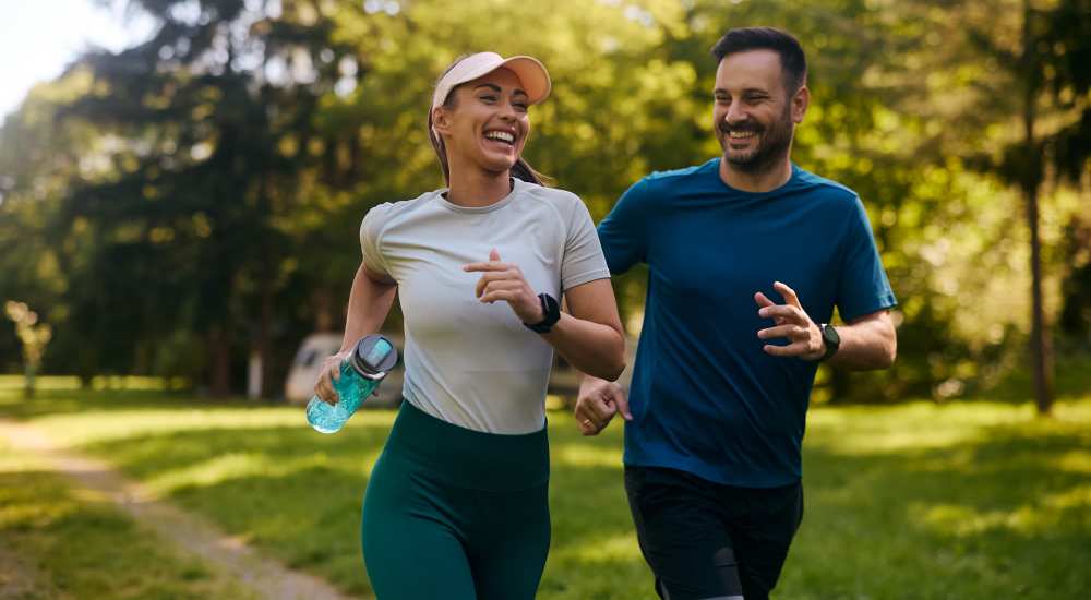 Couple jogging in the park near Arrowhead Park Apartments in Lakewood, Washington