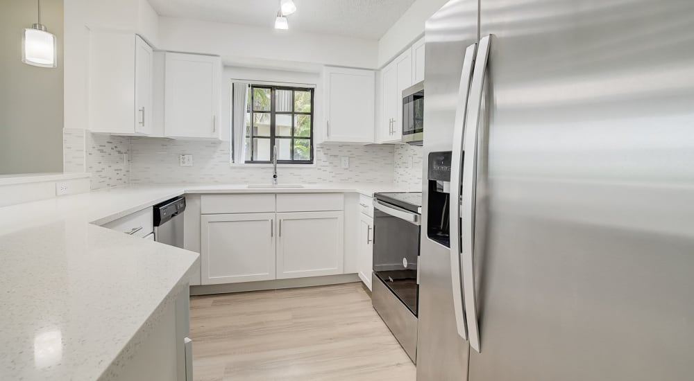 Kitchen with appliance at The Enclave at Delray Beach in Delray Beach, Florida