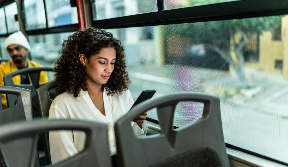 Resident using her phone at Country Brook Rental Condominiums in San Ramon, California