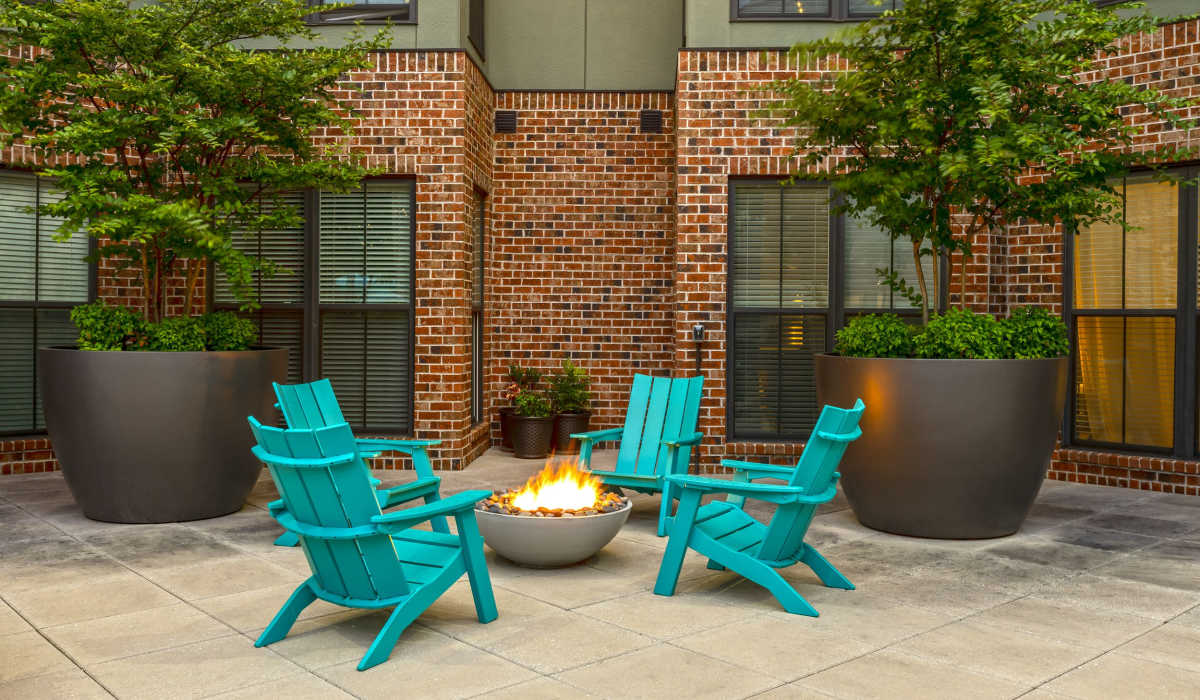Stylish outdoor firepit surrounded with chairs at 1400 Chestnut, Chattanooga, Tennessee