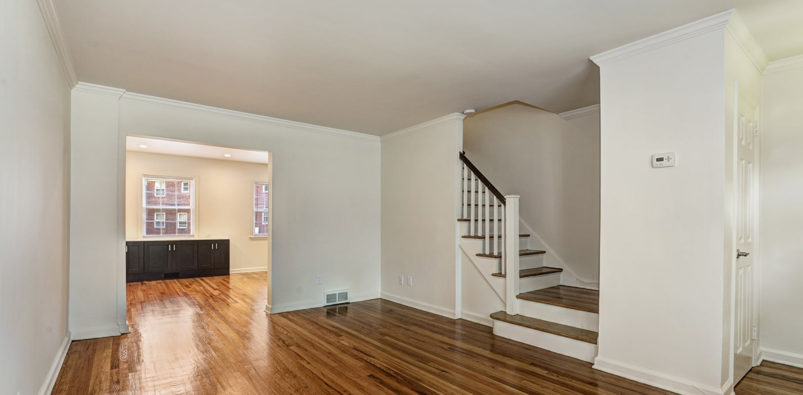 Spacious living room with upstairs access at General Wayne Townhomes and Ridgedale Gardens in Madison, New Jersey