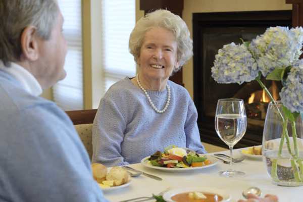 resident couple having a dinner of salad and soup at Dougherty Ferry in Valley Park, MO