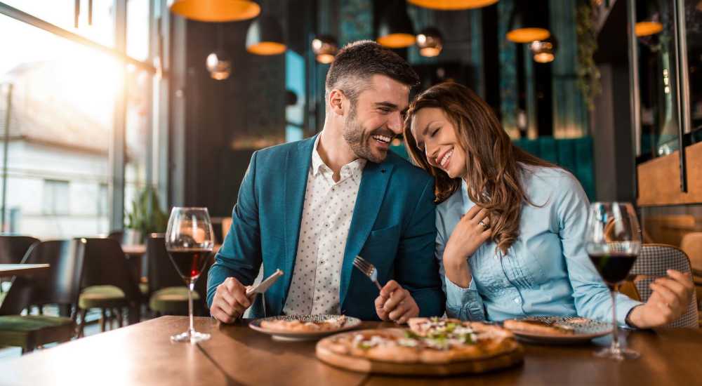 Couple having dinner at restaurant near The Adams at Peppers Ferry in Christiansburg, Virginia