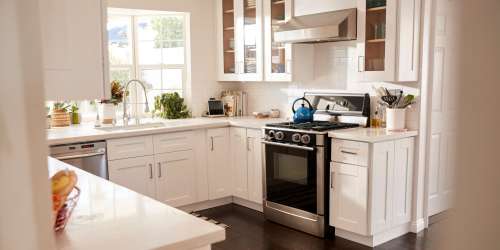 Apartment kitchen with white cabinetry at Clipper Cove in Tampa, Florida