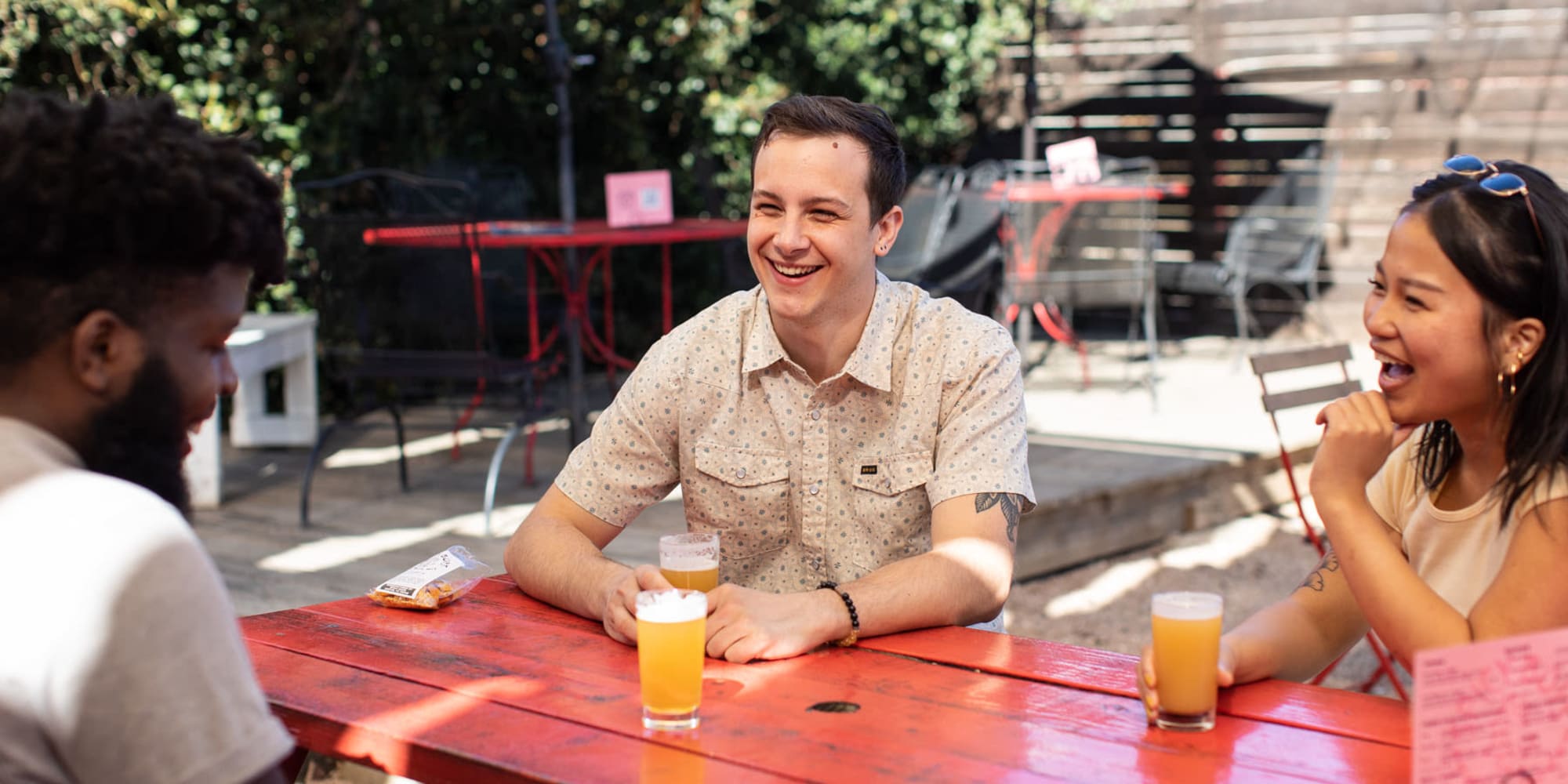 Resident friends enjoying a beer together at their favorite restaurant near 44 South in Austin, Texas
