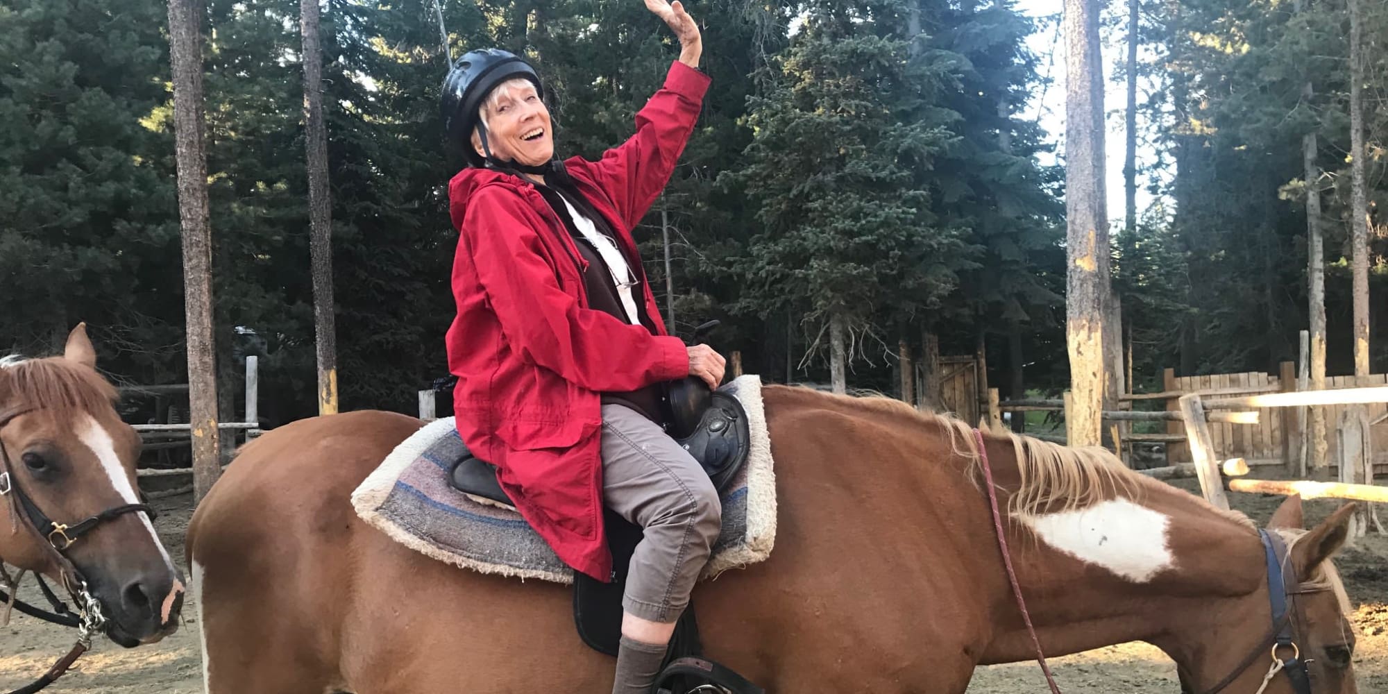 A happy resident from El Dorado Estates Gracious Retirement Living in El Dorado Hills, California on a horse