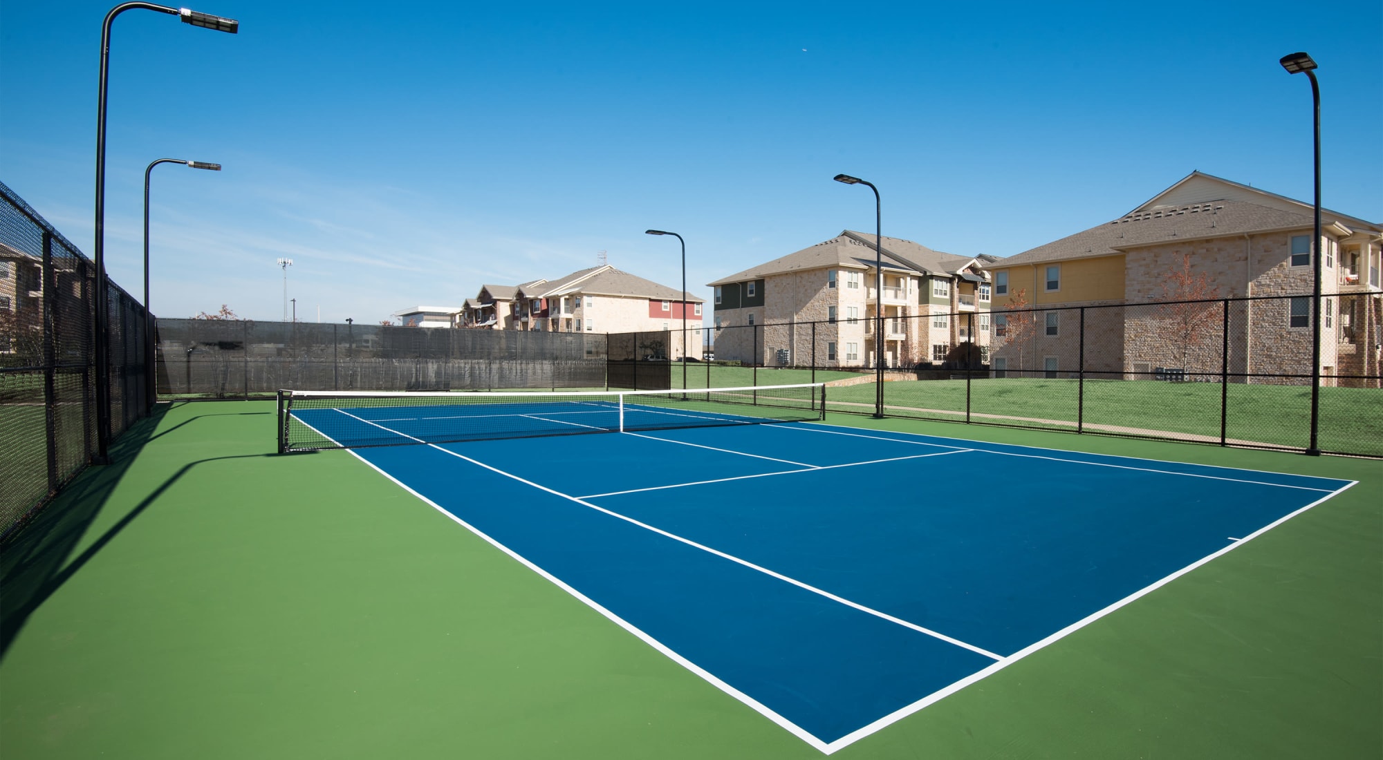 Lighted tennis court at Estates of Richardson