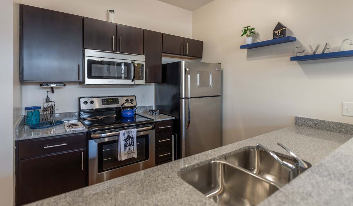 Kitchen with sink and fridge at Attain Shockoe, Richmond, Virginia