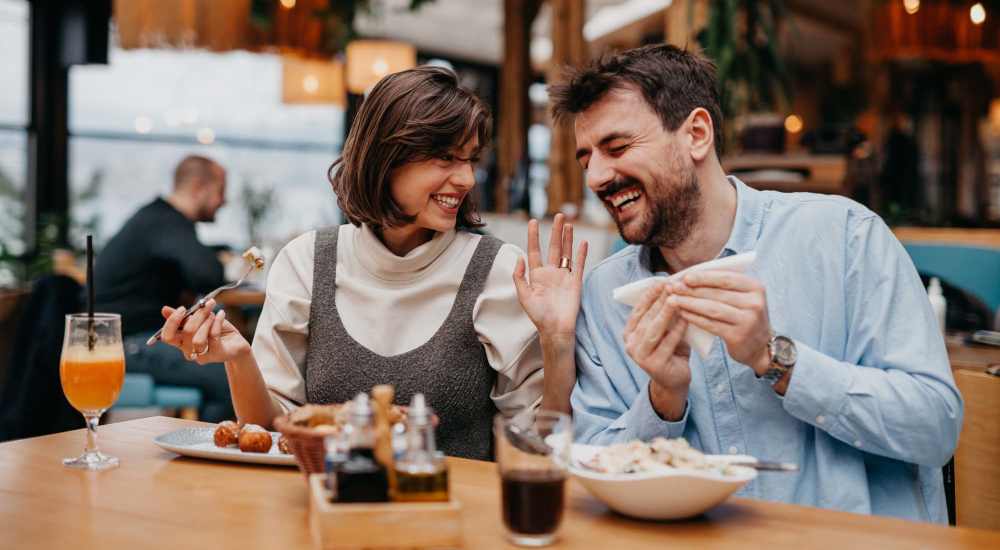 Couple having food at a restaurant near 4315 S. Alder in Tacoma, Washington