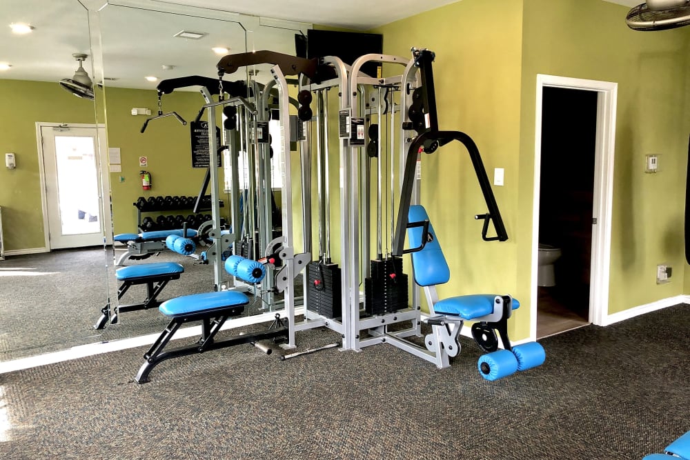 Enjoy apartments with a fitness center at The Abbey at Montgomery Park in Conroe, TX
